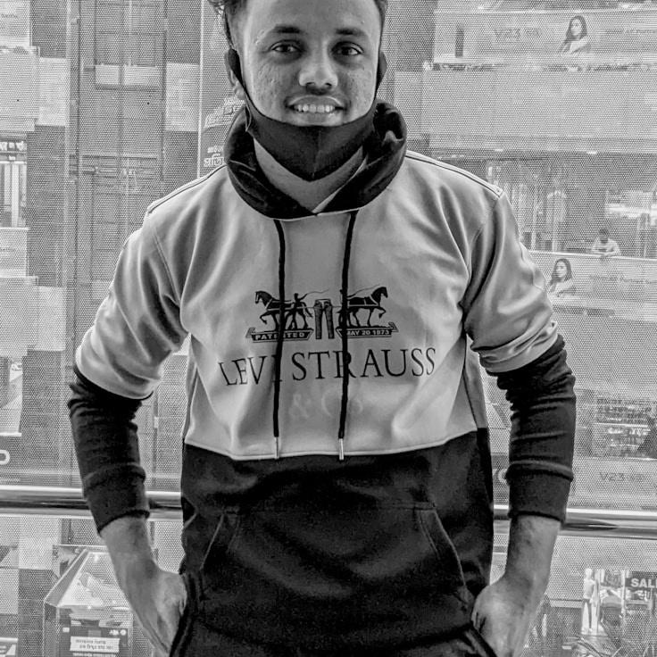 Avery Chen, Lead Design Curator at VoyagePilotRoam, reviewing corporate floral arrangements